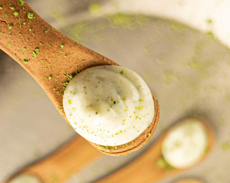 Cream paste on an edible biscuit spoon